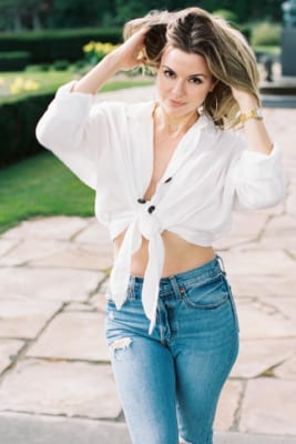 Girl wearing blue jeans and white shirt