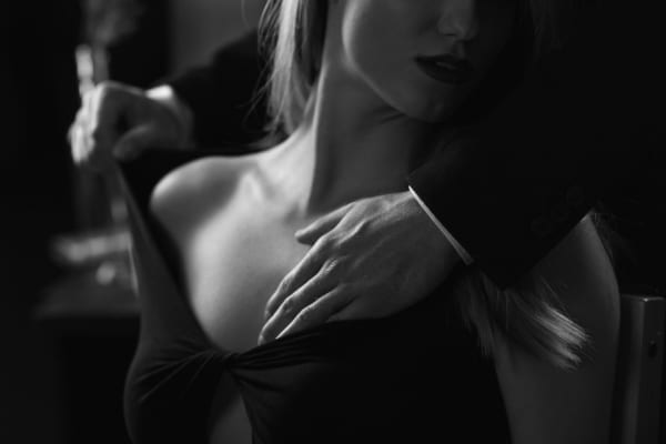 Man touching woman’s breast