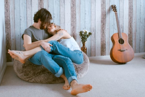 Couple engaged in BDSM aftercare activities
