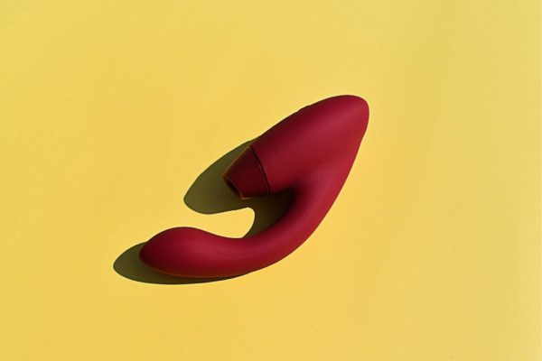 Womanizer Duo on a yellow background