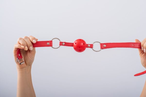 Holding a ball gag