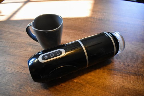 Acmejoy Lester and a coffee cup for size comparison