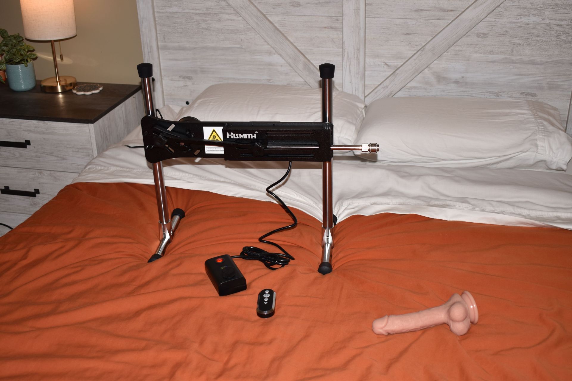 Sex machine on our bed with dildo on the side