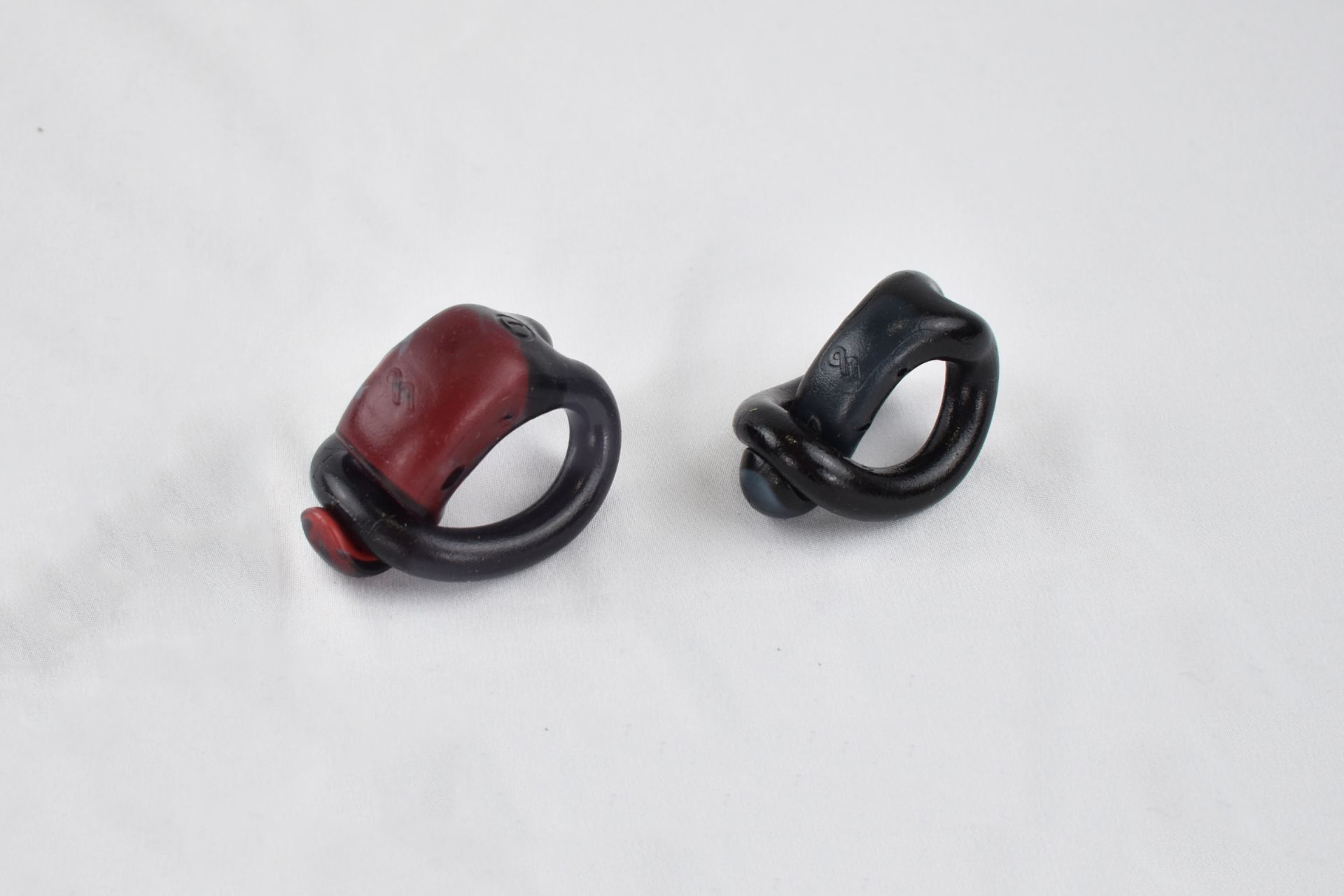 MaxPR cock ring and TechRing cock ring on a table
