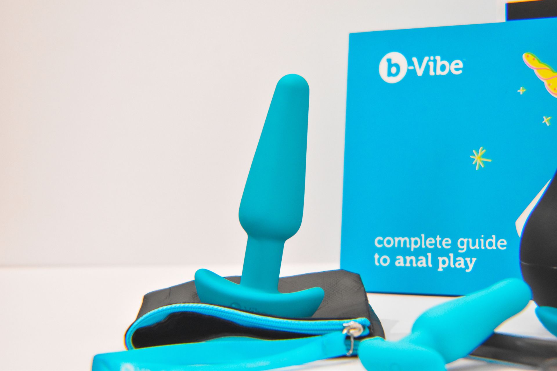 Close up photo of a butt plug with the guide in the background