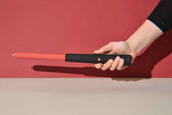 hand pressing a button on Zapper 2.0