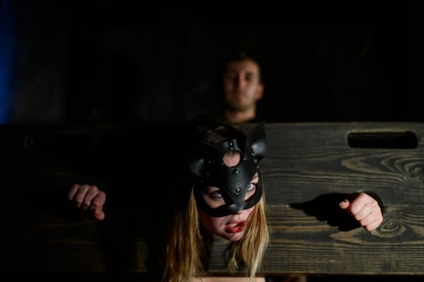 Girl locked in BDSM pillory