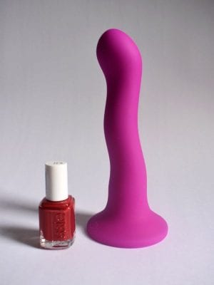 Suction cup dildo and a nail polish