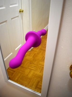 Suction cup dildo on a mirror
