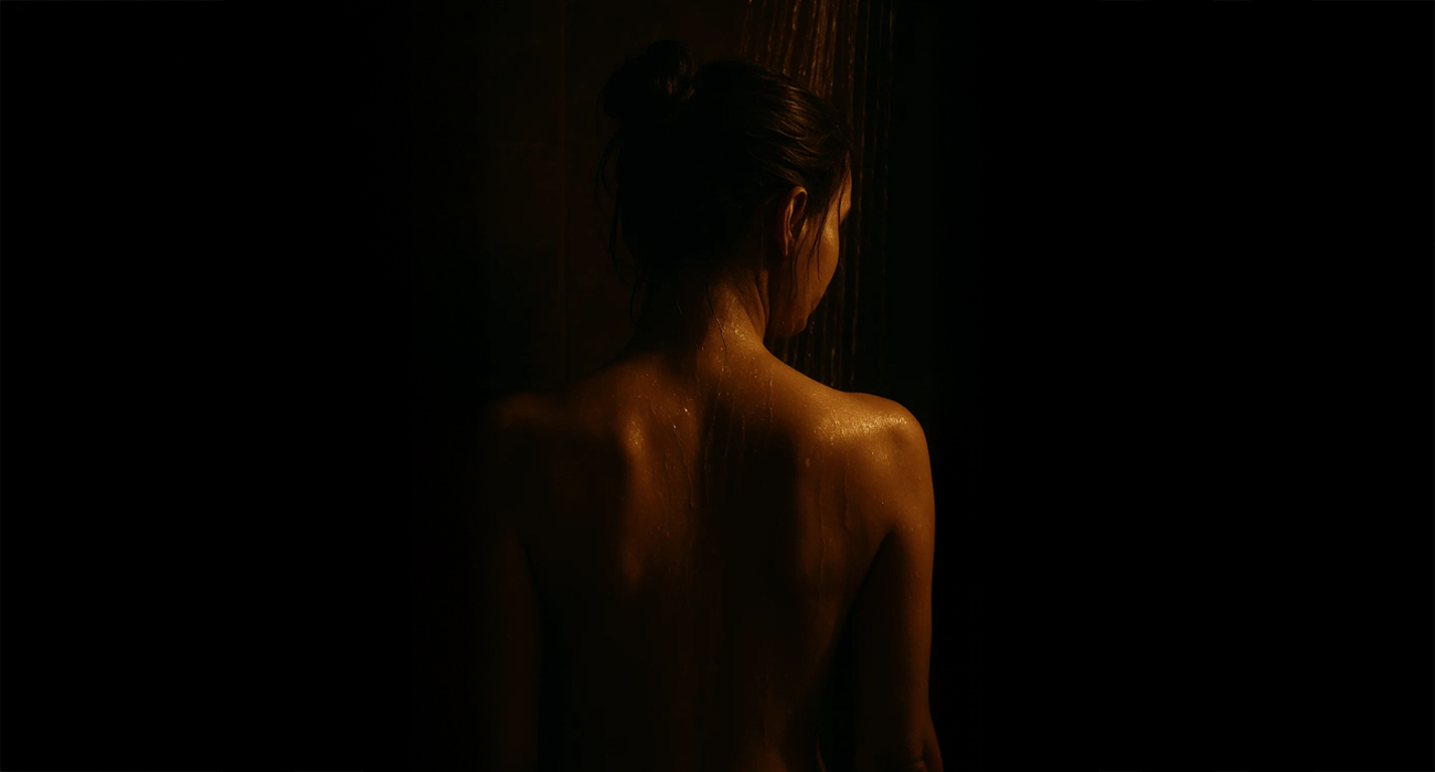 woman's naked back in the shower