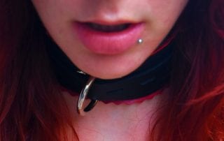 Close up of girl wearing a collar