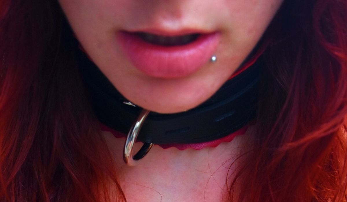 Close up of girl wearing a collar