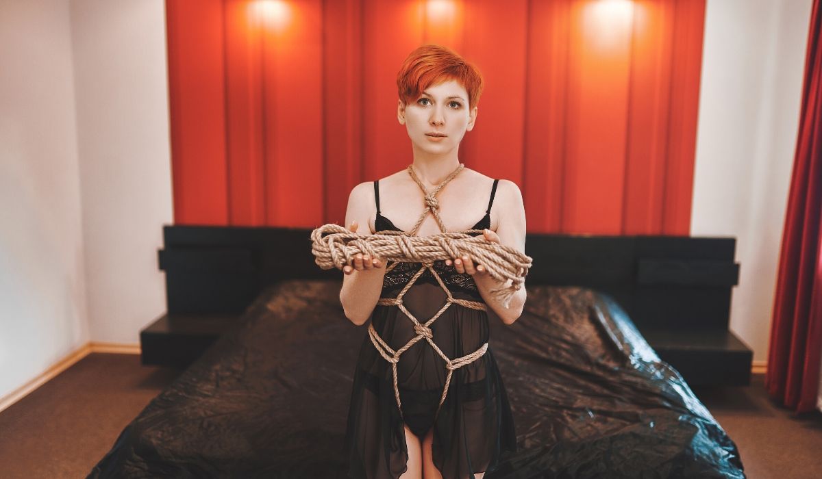 Woman holding bondage rope in her hands