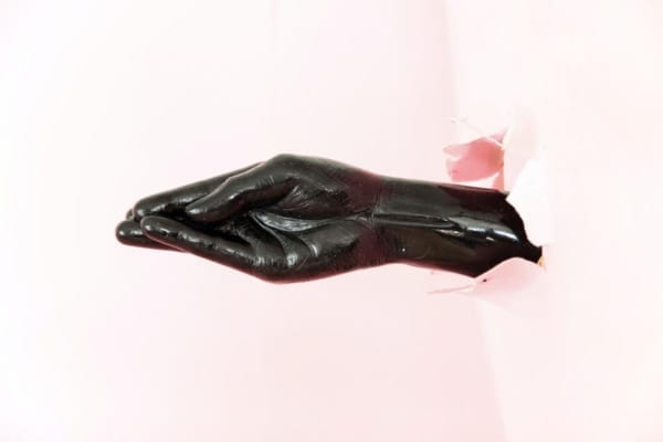 Hand in latex gloves