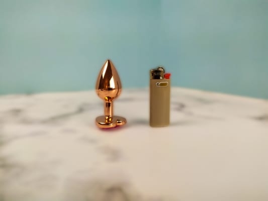 Rear Assets plug and a small BIC lighter
