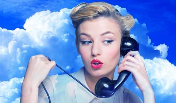 Woman in clouds while having phone sex