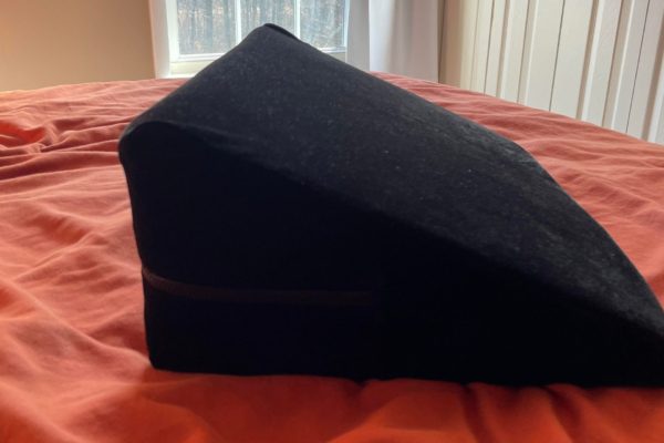 Liberator Wedge on a bed during a review