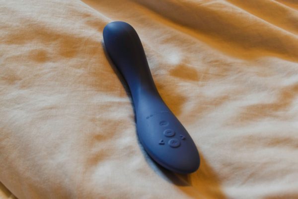 We-Vibe Rave 2 on a bed-min
