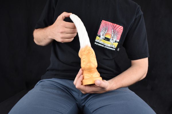 Man showing dildo shaped as unicorn