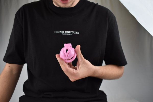 Luka holding Pink Pussy Shaped Chastity Cage